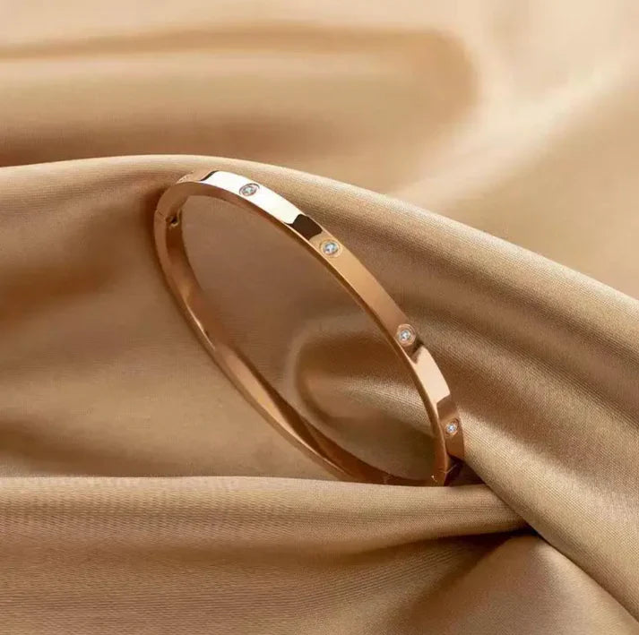 Gold plated bracelet with inlaid zircons